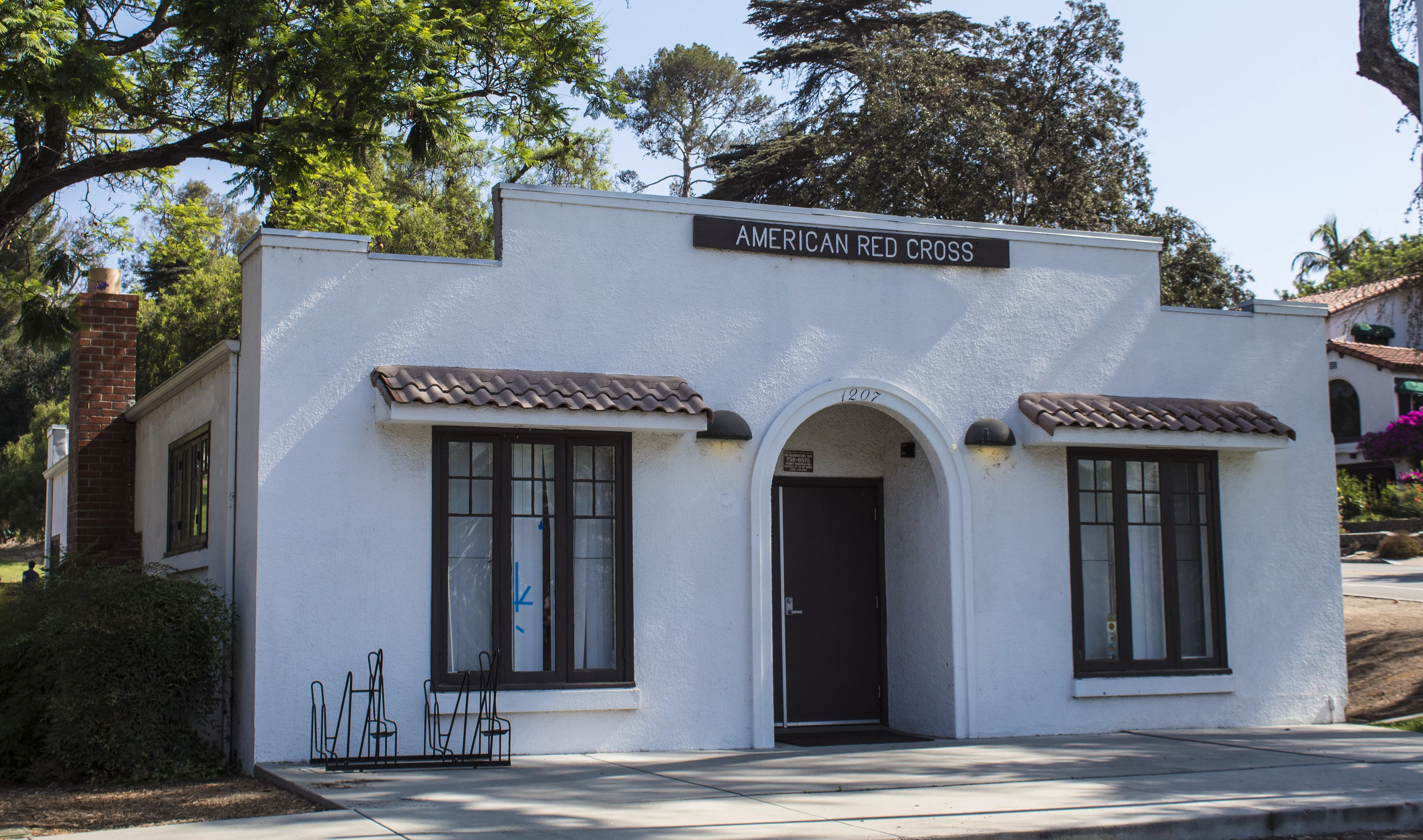 A colored photograph of the American Red Cross building in Hillcrest Park, taken in 2017.