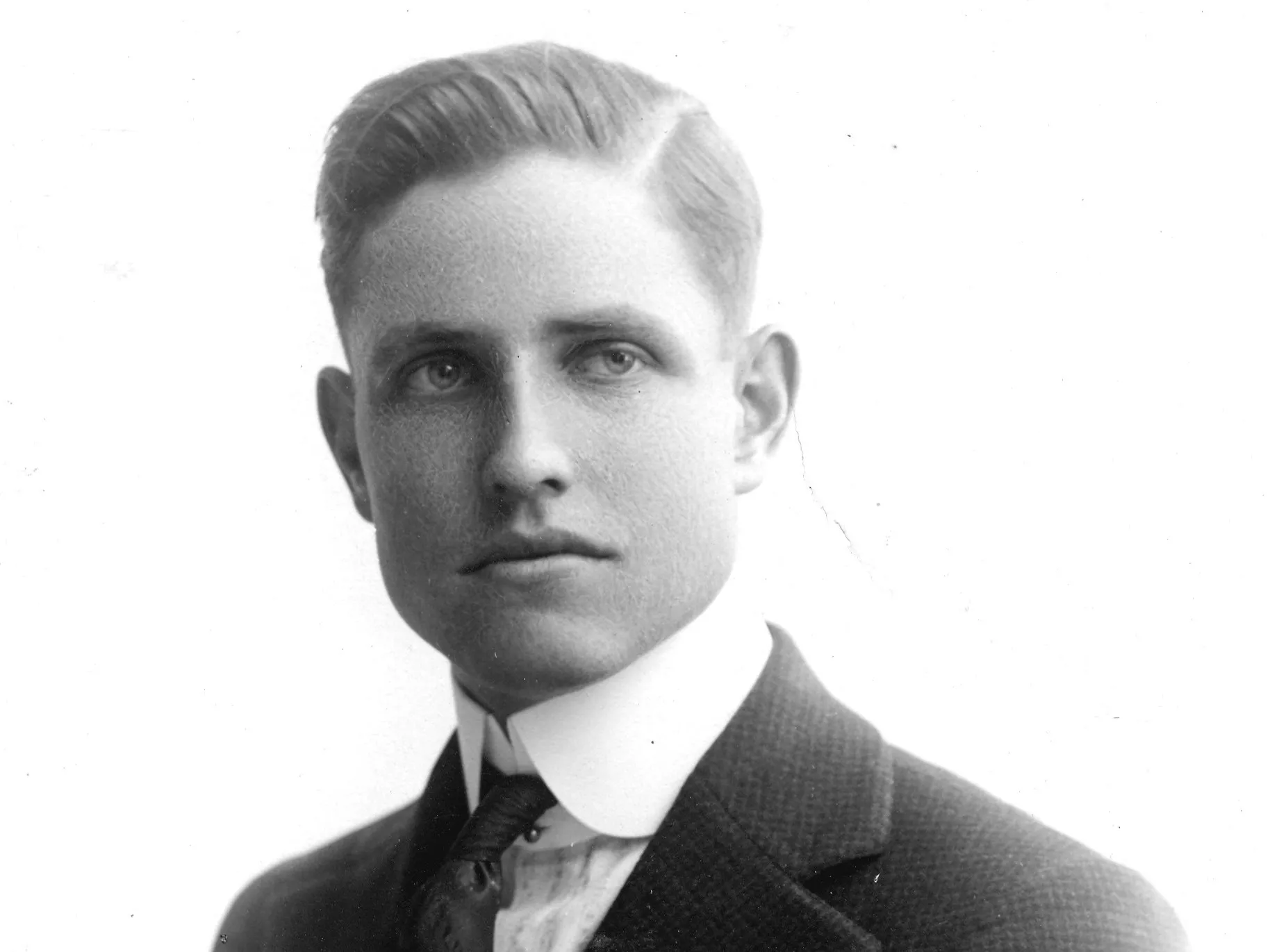 A black and white portrait of Raymond Starbuck.