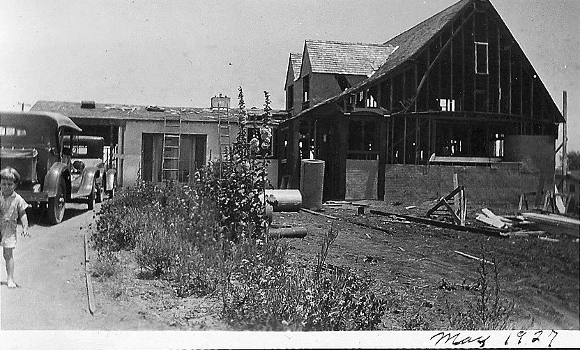 A black and white photograph of the Raymond Starbuck House under construction in 1927.