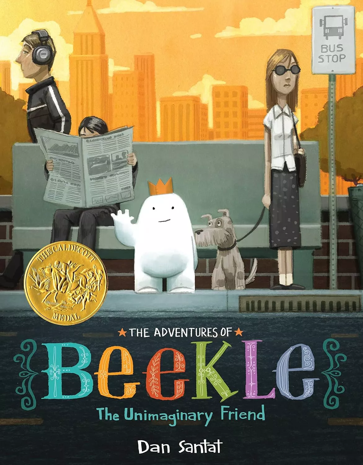 Cover of The Adventures of Beekle: The Unimaginary Friend depicting a small white blob shaped creature waiting at the bus stop, wearing a gold crown and waving. 