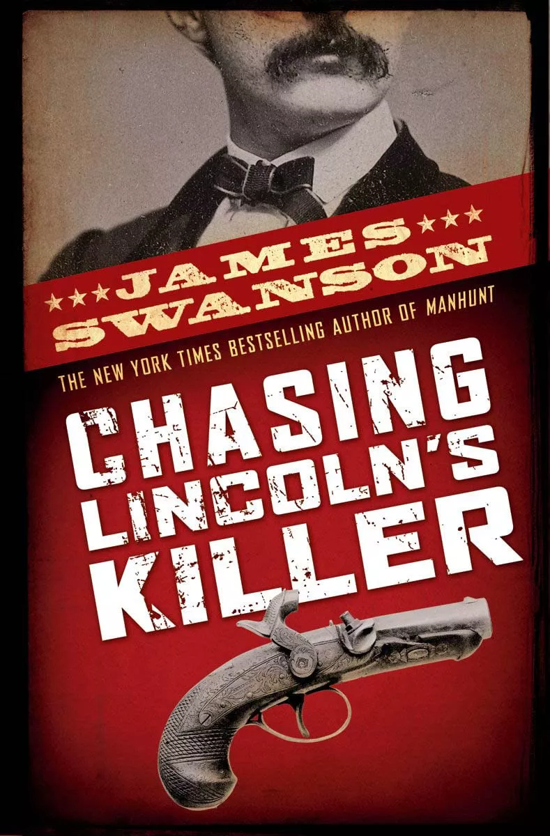 Cover of Chasing Lincoln's Killer by James Swanson depicting the lower half of a man's face above the title and an old timey gun underneath.