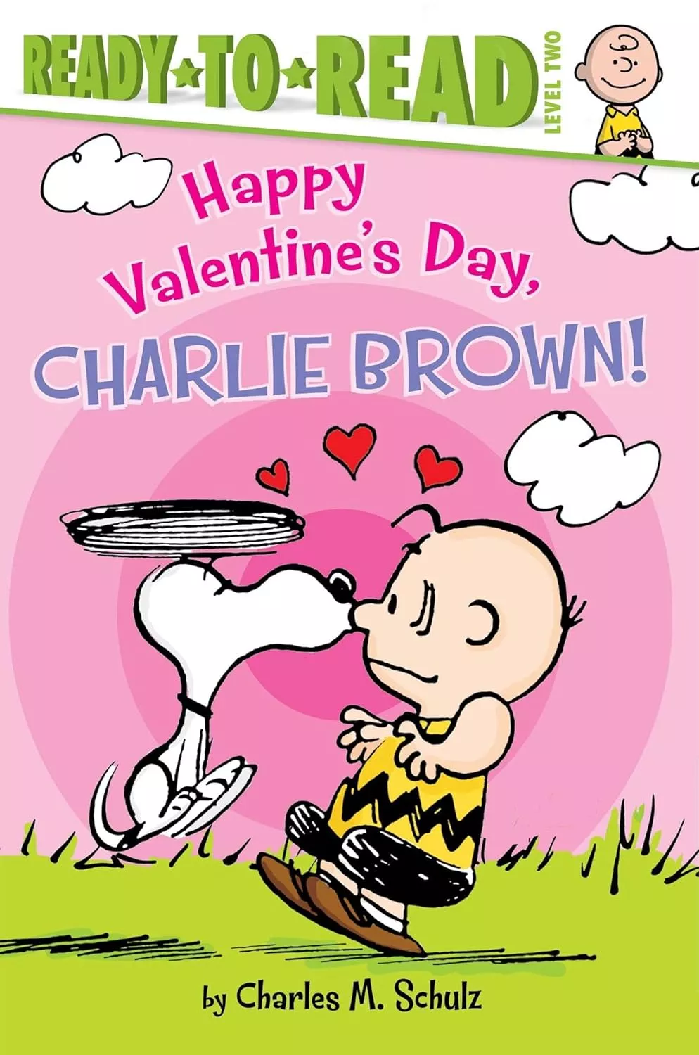 Cover of Happy Valentine's Day, Charlie Brown! by Charles Schultz depicting Snoopy kissing Charlie Brown on the nose.