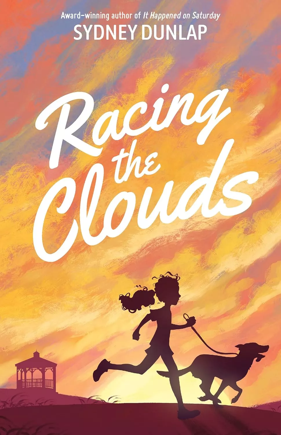 Cover of Racing the Clouds by Sydney Dunlap depicting a girl and a dog running beneath a sky full of orange clouds.