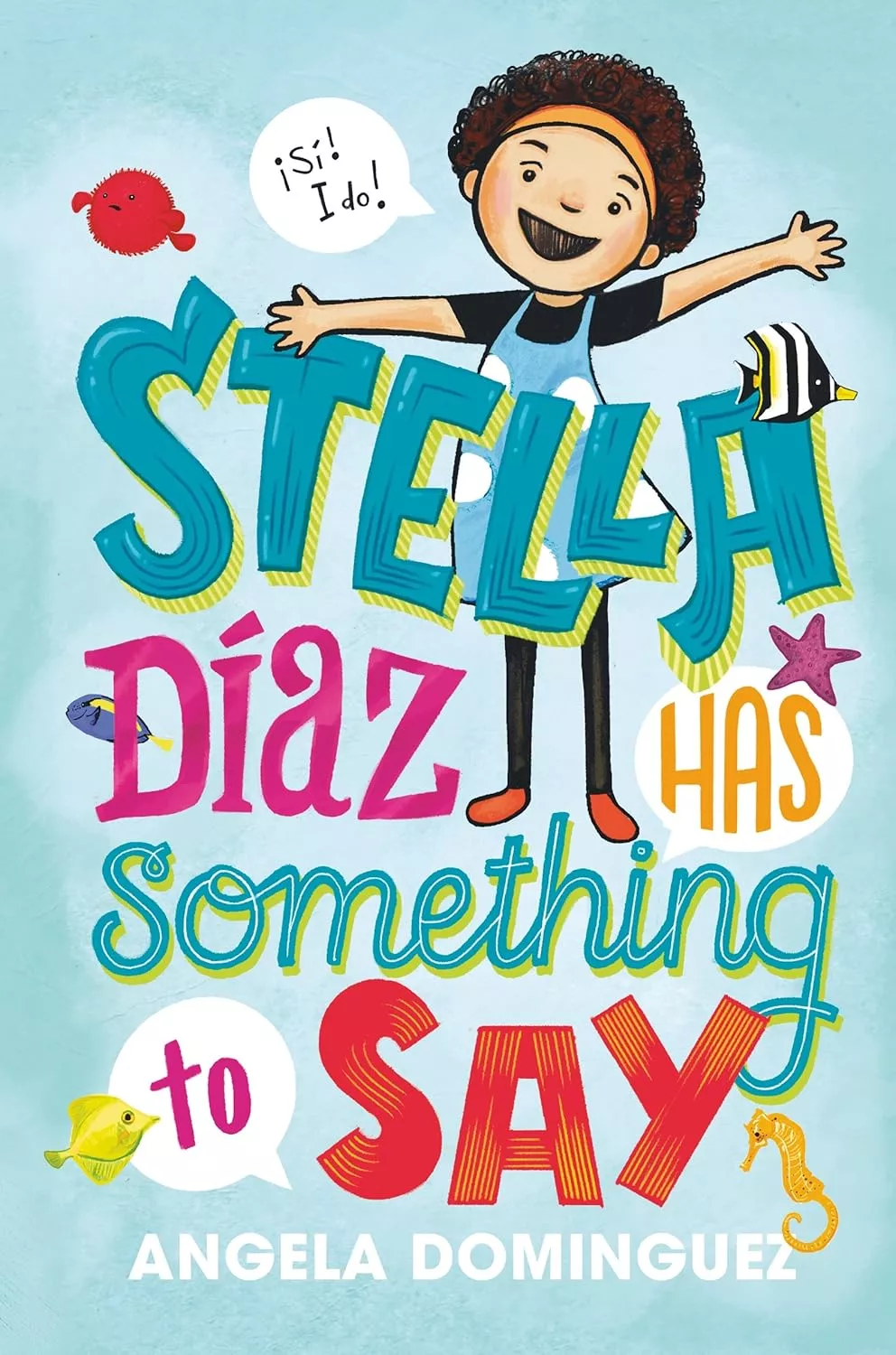 Cover of Stella Díaz Has Something to Say by Angela Dominguez depicting a girl with short, dark, curly hair wearing a black shirt and a denim overall dress. She is raising both of her arms and has a speech bubble that reads "¡Si! I do!"