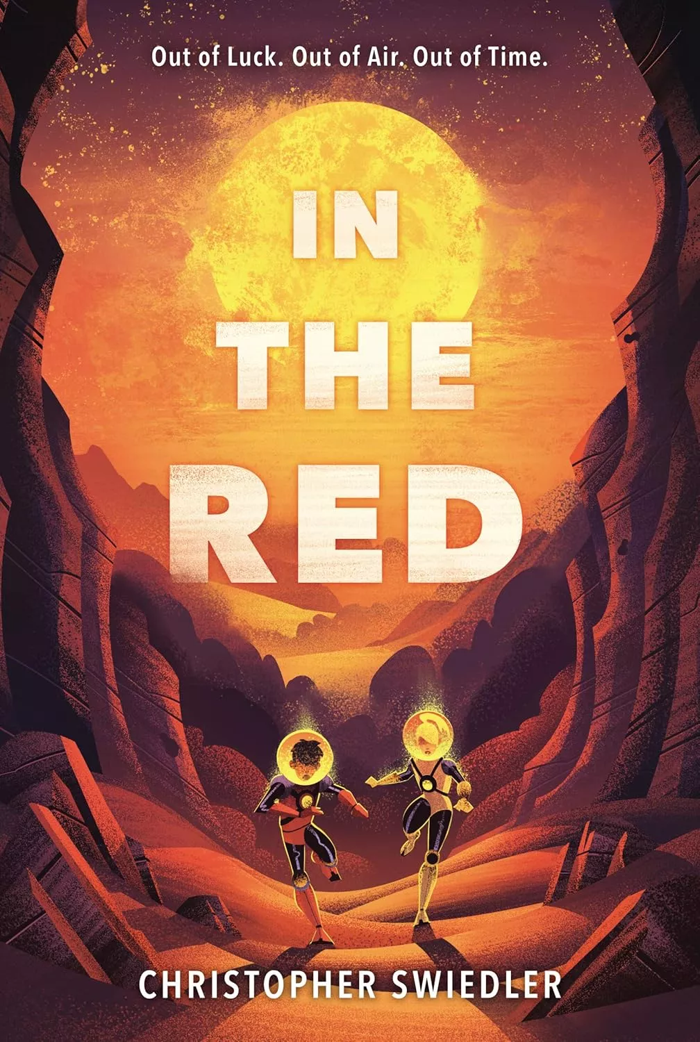 Cover of In the Red by Christopher Swiedler depicting two kids wearing space helmets running through a red desert.